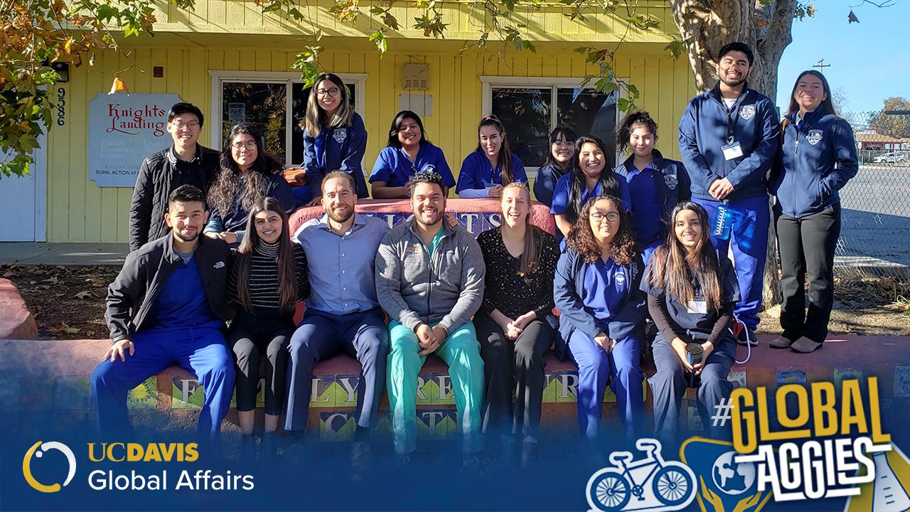 Knights Landing One Health Center undergraduate volunteers and medical student volunteers alongside Ho (top left corner) outside the Free Resource Center in Knights Landing where they provide free medical services to the rural underserved. Global Aggies Spotlight - Header Image