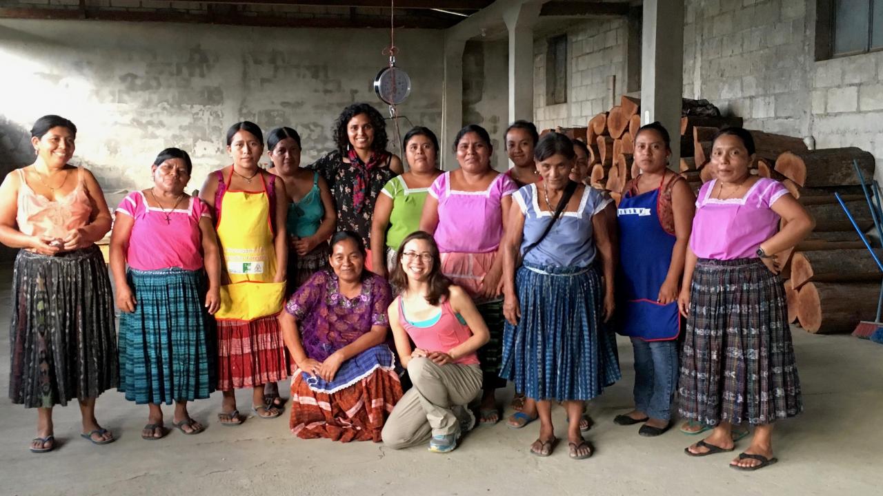 Graduate student Madeline Weeks and Karla Rueda McNeil of Cru Chocolate pose with members of the Red de Mujeres, a women's network in Guatemala