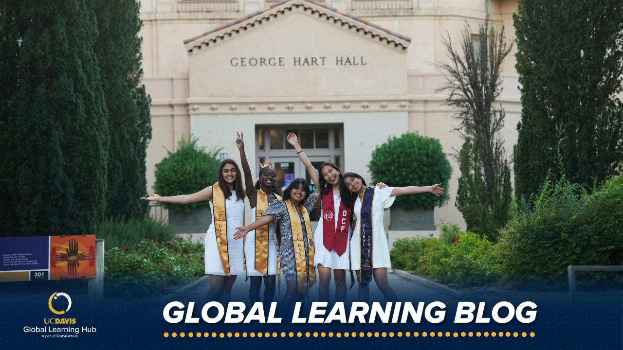 Group photo of students standing in front of the George Hart Hall building on the UC Davis campus.