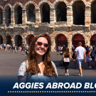 Photo of a student standing in front of the Verona Arena in Verona, Italy.