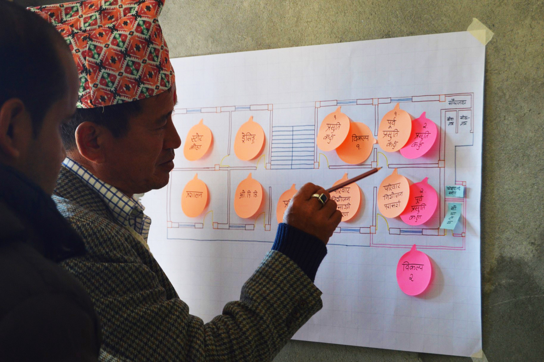 A community member in Nepal providing feedback on a project.