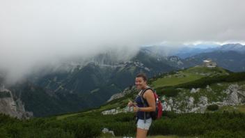 Student on a hike giving a thumbs up to the camera.