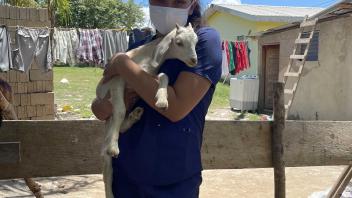 student holding an animal
