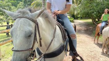 student riding a horse