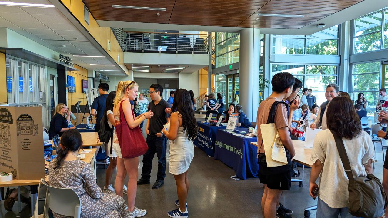Students interacting at a Global Learning Hub event in the International Center at UC Davis..