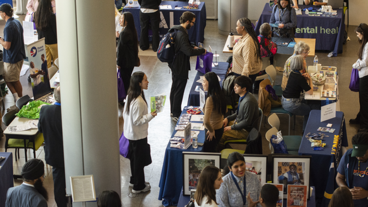 Students engaging with exhibitors at the Exhibitor Fair.