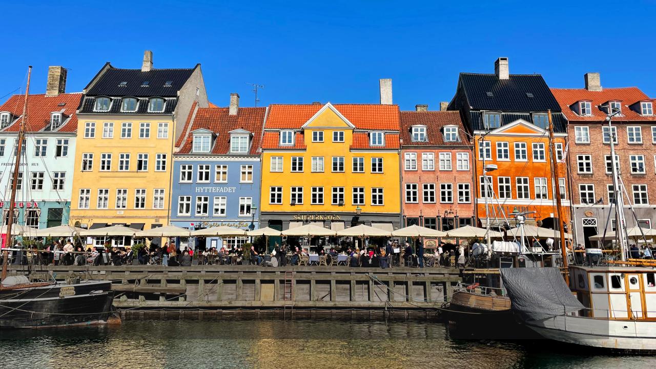 Colorful buildings line the street.