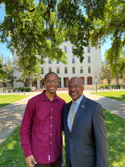 Comeaux and Chancellor May stand side by side in front of Mrak Hall.
