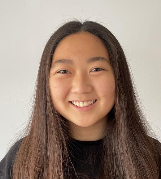 A headshot style photo of a student with a plain background.