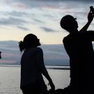 silhouette photo of students taking a video selfie
