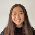 A headshot style photo of a student with a plain background.