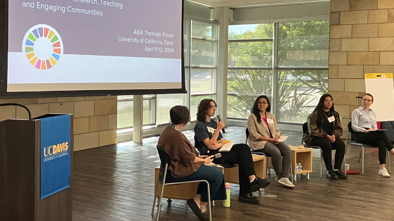Becca Libby speaking on a student panel at UC Davis’ AIEA Thematic Forum